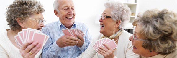 senior citizens playing cards